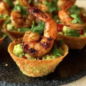Cajun Guacamole Shrimp Cups 2 Cajun guacamole shrimp cups served on a platter.