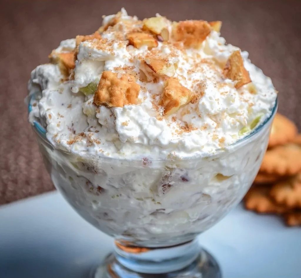 Creamy Apple Pie Fluff Salad with diced apples and whipped cream