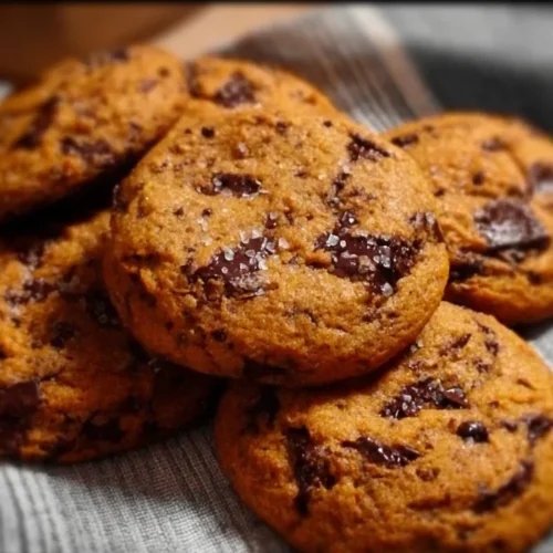 Chewy pumpkin chocolate chip cookies served on a plate