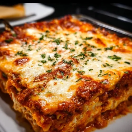 Easy Lasagna 2 Delicious easy lasagna with layers of cheese, pasta, and sauce