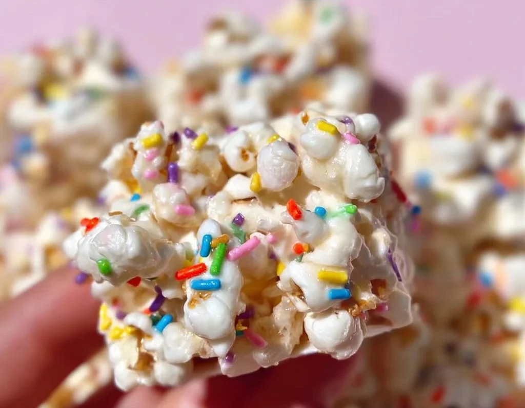 Funfetti Marshmallow Popcorn Treats 2 Colorful Funfetti Marshmallow Popcorn Treats displayed in a festive bowl
