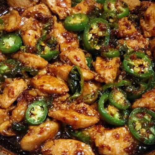 Jalapeno Chicken 3 Spicy jalapeno chicken served with vegetables on a plate
