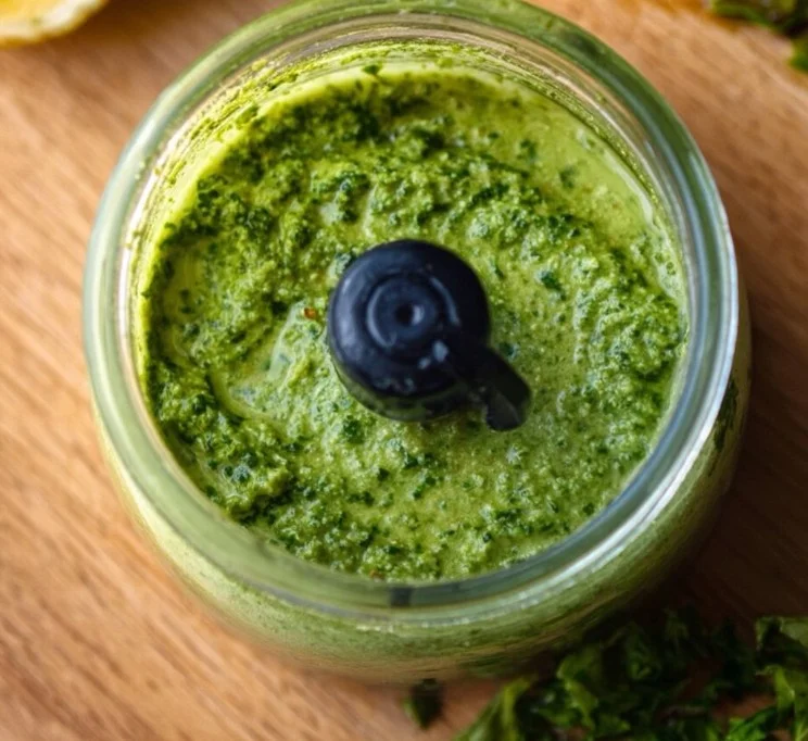 Pesto Sauce Without Nuts 1 Nut-free pesto sauce ingredients and finished dish on a wooden table