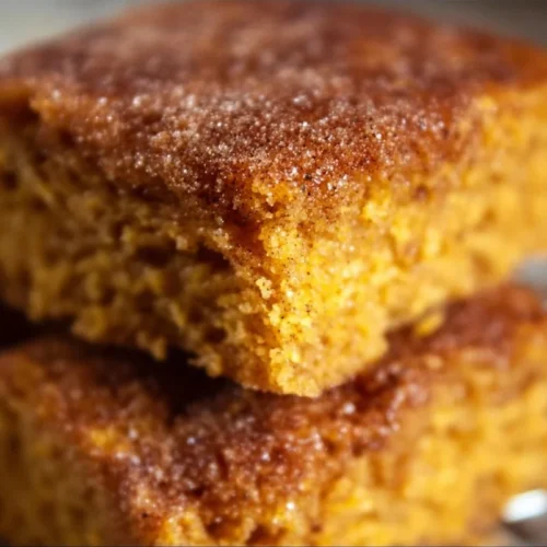 Delicious Pumpkin Snickerdoodle Snack Cake topped with cinnamon sugar