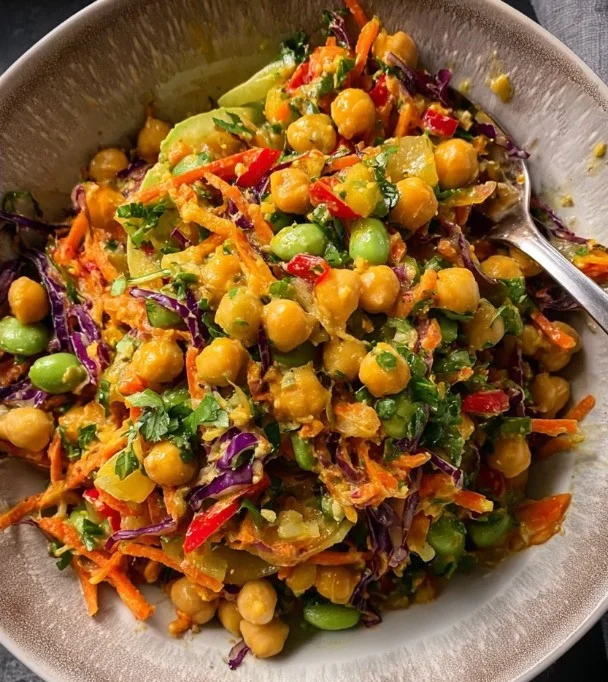 Colorful Thai-inspired chickpea salad with fresh vegetables and dressing