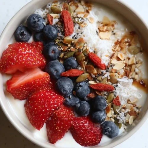 Delicious Greek yogurt protein bowl topped with fresh fruits and nuts