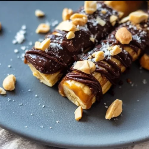Easy Frozen Banana Snickers 2 Easy frozen banana Snickers dessert recipe with bananas, chocolate, and peanuts
