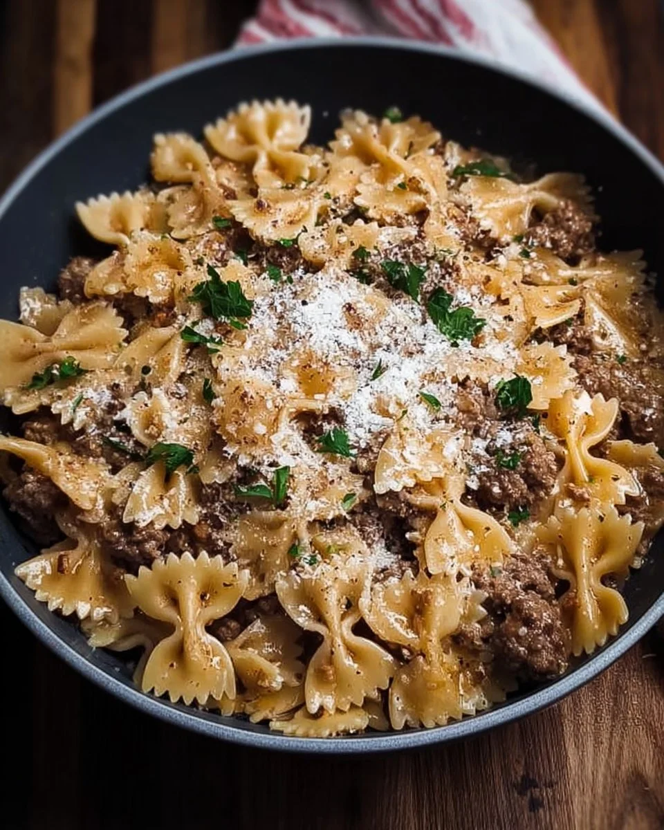 Garlic Parmesan Bowtie Pasta with Creamy Beef recipe 1 Creamy Garlic Parmesan Bowtie Pasta with Beef on a plate