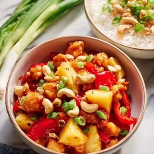 Homemade Chicken Pineapple with Cashews 2 Delicious homemade chicken pineapple with cashews served on a plate