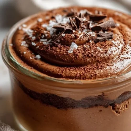 Delicious chocolate cheesecake served in jars for a convenient dessert option