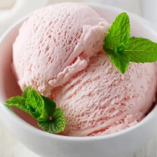 Delicious rhubarb vanilla ice cream served in a bowl with a spoon