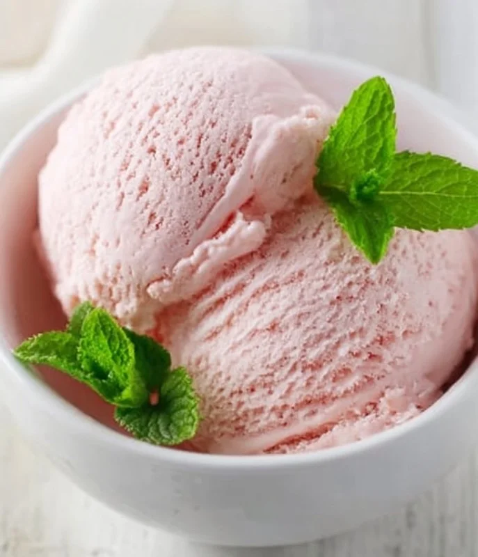 Delicious rhubarb vanilla ice cream served in a bowl with a spoon