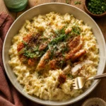 Parmesan-Crusted Chicken served with lemon pasta on a plate